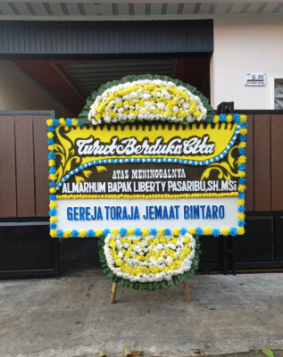 Papan Bunga Duka di Awang